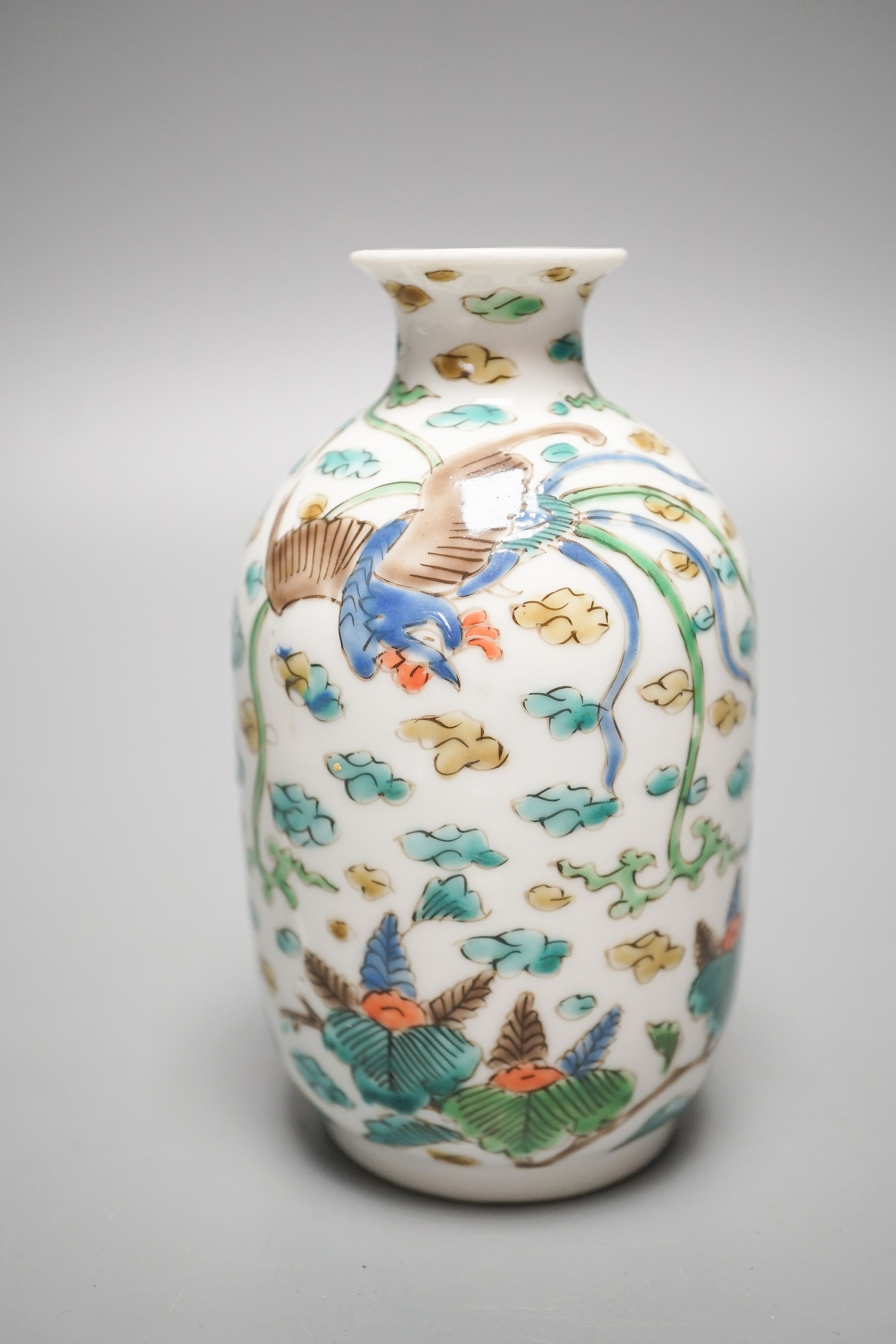 Two Chinese porcelain saucer dishes and an enamelled porcelain vase, 18th century and later, 12.5cm